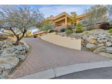 Luxury home with paver driveway, stunning architecture, and desert landscaping at 15418 N Castillo Dr, Fountain Hills, AZ 85268