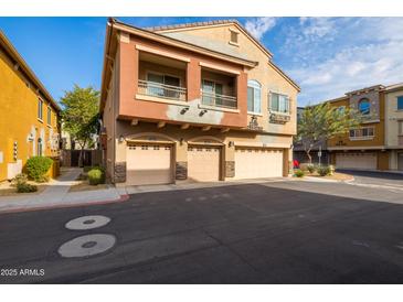 Two-story townhome with attached garage and desert landscaping at 2150 W Alameda Rd # 1251, Phoenix, AZ 85085