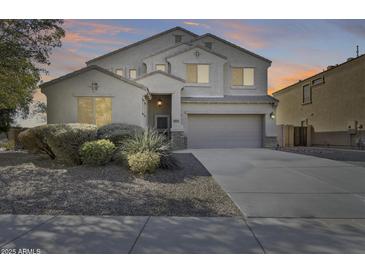 Two-story house with a large driveway and landscaping at 24710 N 27Th Pl, Phoenix, AZ 85024