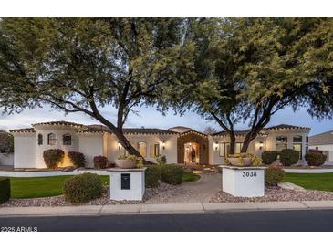 Stunning curb appeal with a beautifully landscaped front yard at 3038 E Waterman Way, Gilbert, AZ 85297