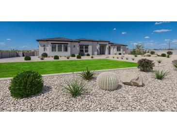 Landscaped front yard with drought-tolerant plants and rock at 39027 N 6Th Dr, Phoenix, AZ 85086