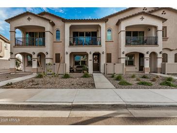 Three-unit townhome building with front yards and individual entrances at 4134 E Pinto Dr, Gilbert, AZ 85296