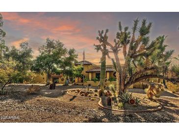 Spanish-style home with desert landscaping and stunning sunset views at 4979 E Calle De Los Arboles --, Cave Creek, AZ 85331