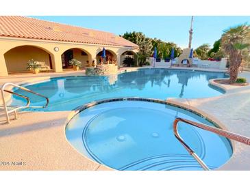 Inviting community pool with spa and relaxing patio area at 5830 E Mckellips Rd # 101, Mesa, AZ 85215