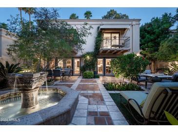 Elegant courtyard with fountain and patio furniture, adjacent to the home at 7500 E Mccormick Pkwy # 63, Scottsdale, AZ 85258