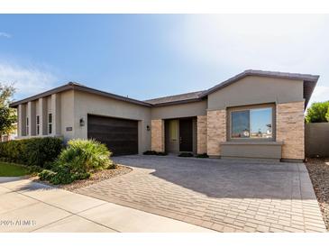 Modern single-story home with neutral exterior and landscaped front yard at 17183 W San Marcos St, Surprise, AZ 85388