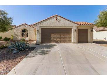 Two-car garage and front yard landscaping at 21532 N 262Nd Ln, Buckeye, AZ 85396