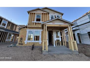 Two-story house under construction with gray siding and a covered porch at 2224 W Chisum Trl, Phoenix, AZ 85085