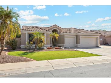 Single-story home with a two-car garage and nicely landscaped front yard at 3165 E Indigo Bay Dr, Gilbert, AZ 85234