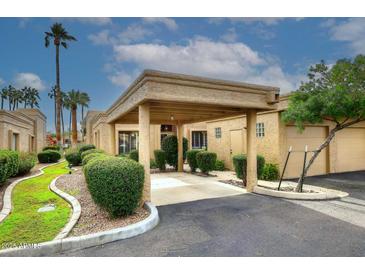 Covered carport with lush landscaping and nicely manicured bushes at 4015 N 78Th St # 141, Scottsdale, AZ 85251