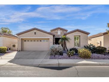 Single-story home with desert landscaping and two-car garage at 4531 E Jude Ln, Gilbert, AZ 85298