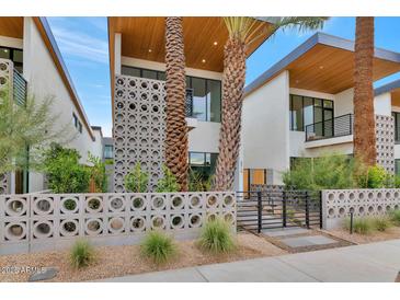 Modern two-story home with a sleek design and landscaped front yard at 6916 E 2Nd St, Scottsdale, AZ 85251