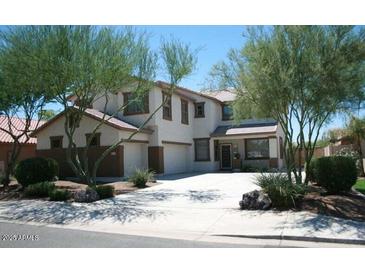 Two-story house with attached garage and landscaping at 11433 E Peterson Ave, Mesa, AZ 85212