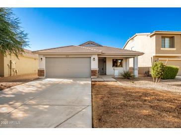 One-story home with gray garage door and landscaping at 1749 W Desert Mountain Dr, San Tan Valley, AZ 85144