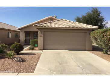 Single-story home with attached garage and desert landscaping at 2030 N 108Th N Dr, Avondale, AZ 85392