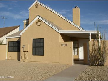 Tan two-story house with a walkway and small front yard at 2138 W Beaubien Dr, Phoenix, AZ 85027