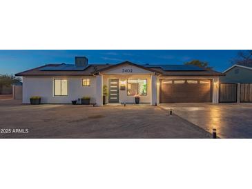 Updated single-level home with solar panels and a two-car garage at 3402 E Sunnyside Dr, Phoenix, AZ 85028