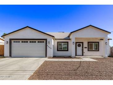 Newly constructed home with a modern facade and attached garage at 4229 N 32Nd Ave, Phoenix, AZ 85017