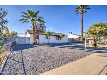 Newly renovated home with a clean, modern exterior and nicely landscaped front yard at 5538 N 63Rd Ave, Glendale, AZ 85301