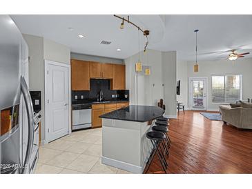 Modern kitchen with stainless steel appliances and granite countertops at 945 E Playa Del Norte Dr # 1014, Tempe, AZ 85288