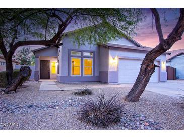 One-story house with a two-car garage and desert landscaping at 2304 S Abbey --, Mesa, AZ 85209