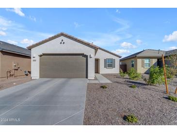 Single-story home with a two-car garage and landscaped front yard at 2732 E Trail Blazer Dr, San Tan Valley, AZ 85140