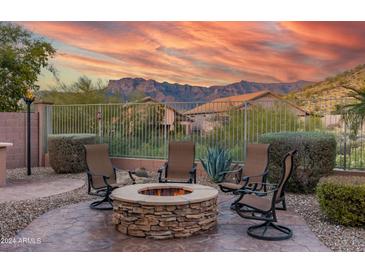 Relaxing backyard firepit area with mountain views, perfect for entertaining at 4202 S Cordia Ct, Gold Canyon, AZ 85118