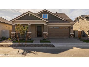 Craftsman style home with a two-car garage and landscaped front yard at 4267 E Bernice St, Gilbert, AZ 85295