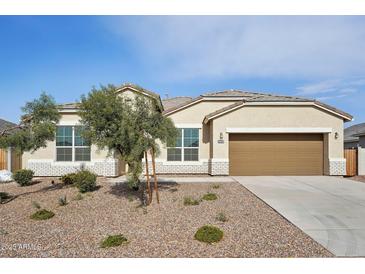 Single-story house with a two-car garage and desert landscaping at 44478 W Palo Abeto Dr, Maricopa, AZ 85138