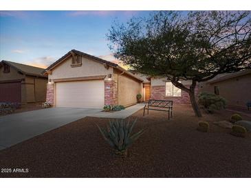 Charming one-story home with a two-car garage and landscaped front yard at 9945 E Prospector Dr, Gold Canyon, AZ 85118