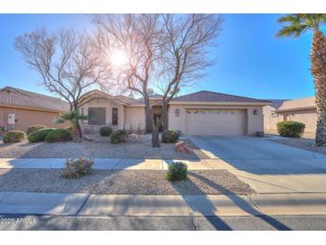 Single-story home with desert landscaping and two-car garage at 143 S Los Cielos Ln, Casa Grande, AZ 85194