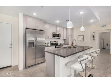 Modern kitchen with stainless steel appliances and island at 155 N Lakeview Blvd # 100, Chandler, AZ 85225