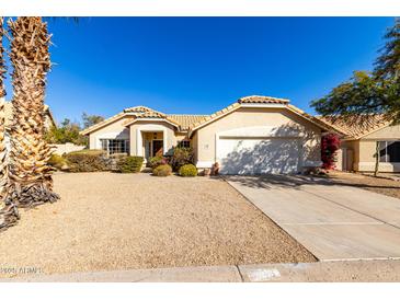 Single-story home with desert landscaping and two-car garage at 16146 E Gleneagle Dr, Fountain Hills, AZ 85268