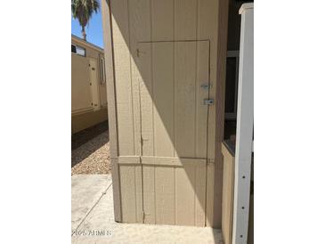 Exterior storage with wooden door and lock at 17200 W Bell Rd # 1599, Surprise, AZ 85374