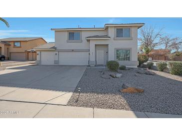 Two-story house with a two-car garage and desert landscaping at 277 E Windsor Ct, Gilbert, AZ 85296