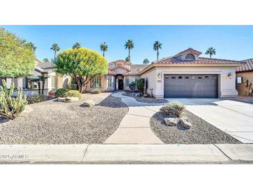 Single-story home with desert landscaping and a two-car garage at 3199 N 159Th Dr, Goodyear, AZ 85395