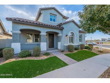 Two-story house with attractive landscaping and a welcoming front porch at 4137 E Ronald St, Gilbert, AZ 85295