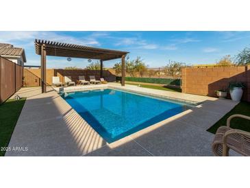 Inviting rectangular pool with pergola and lounge chairs at 5629 S Veneto --, Mesa, AZ 85212