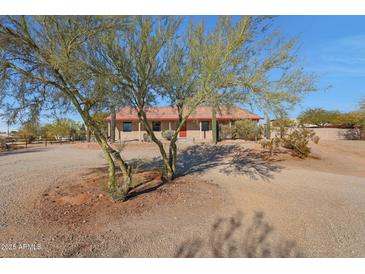 Ranch-style home with red tile roof and desert landscaping at 5820 E Morning Vista Ln, Cave Creek, AZ 85331