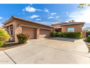 Beautiful two-story home with a three-car garage and landscaped front yard at 1819 W Magdalena Ln, Phoenix, AZ 85041