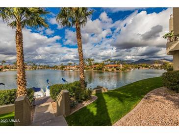 Scenic waterfront view with boats and lush landscaping at 10080 E Mountainview Lake Dr # 242, Scottsdale, AZ 85258