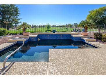 Inviting pool with golf course view; perfect for relaxation at 13105 W Micheltorena Dr, Sun City West, AZ 85375