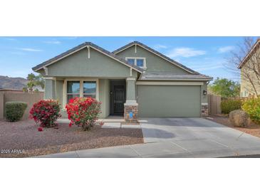 Single-story home with attached garage and landscaping at 2405 E Beverly Rd, Phoenix, AZ 85042