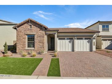 Single-story home with stone accents and a two-car garage at 26123 N 20Th Dr, Phoenix, AZ 85085