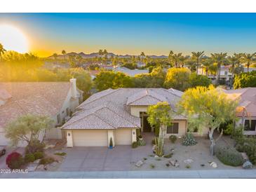 Luxury home with desert landscaping, pool, and mountain views at 9690 N 117Th Way, Scottsdale, AZ 85259