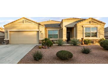 Single-story home with desert landscaping and a two-car garage at 3583 N Brooklyn Dr, Buckeye, AZ 85396