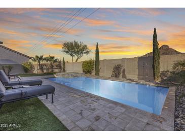 Stunning pool and spa with plenty of lounge space at 5826 W Plum Rd, Phoenix, AZ 85083