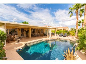 Stunning pool and patio area perfect for entertaining at 13827 W Junipero Dr, Sun City West, AZ 85375