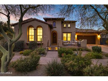 Attractive two-story home with landscaping and a welcoming front porch at 17708 N 92Nd St, Scottsdale, AZ 85255