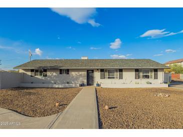 Newly renovated single story home with a landscaped front yard and walkway at 2870 W Manzanita St, Apache Junction, AZ 85120